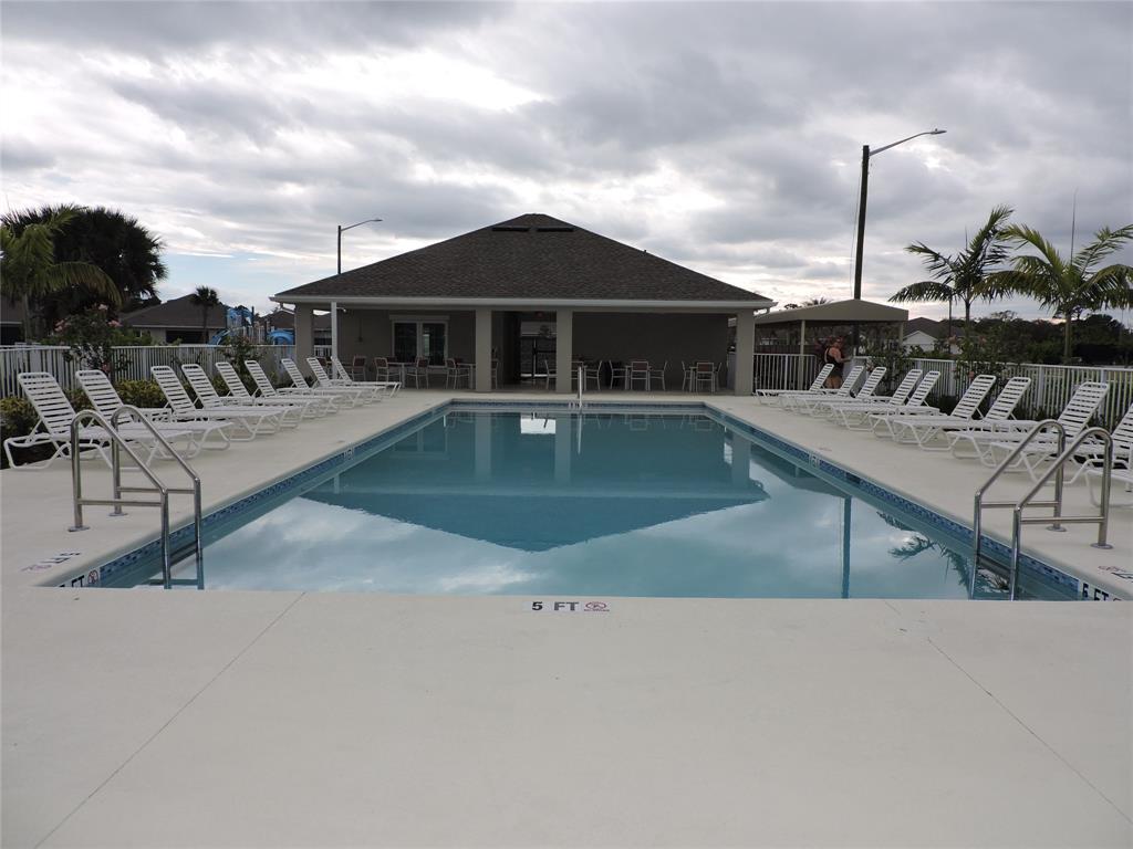 836 Persimmon Place Fort Pierce, FL 34981 - Photo 73 of 78 a view of a house with pool