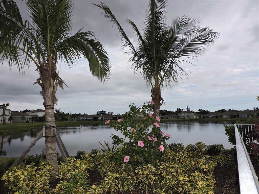 836 Persimmon Place Fort Pierce, FL 34981 - Photo 74 of 78 a lake view with a garden