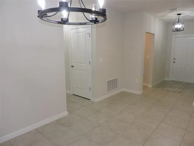 a kitchen with a sink a counter top space cabinets and stainless steel appliances