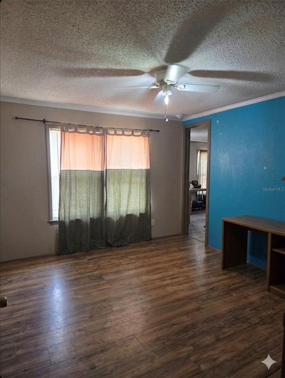 4738 Southwest 166th Court Road Ocala, FL 34481 - Photo 10 of 14 an empty room with wooden floor and windows