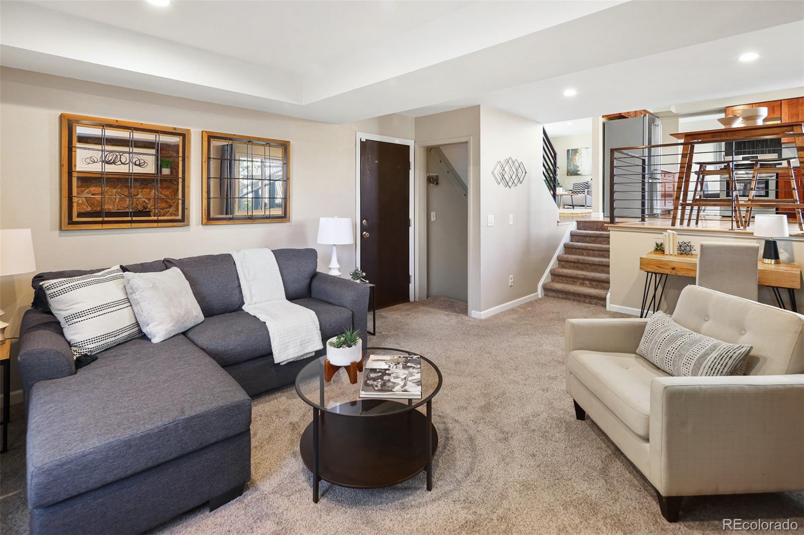 10499 Newcombe Street Westminster, CO 80021 - Photo 14 of 33 a living room with furniture and a large window