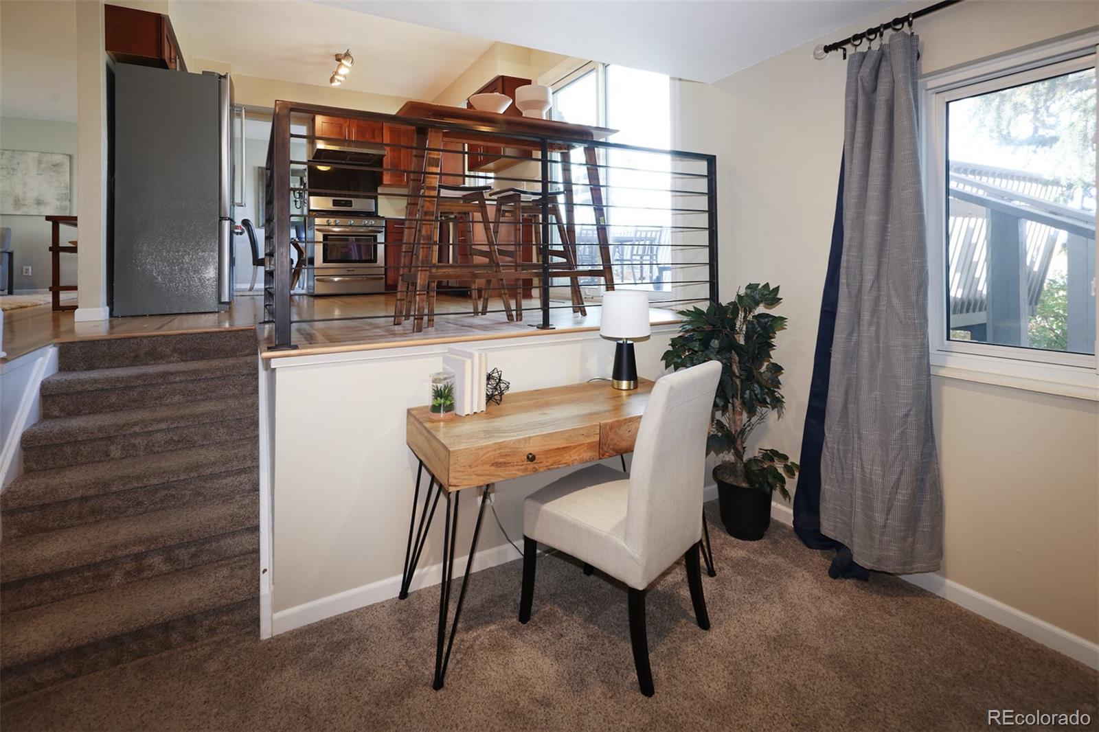 10499 Newcombe Street Westminster, CO 80021 - Photo 15 of 33 a dining room with furniture and window