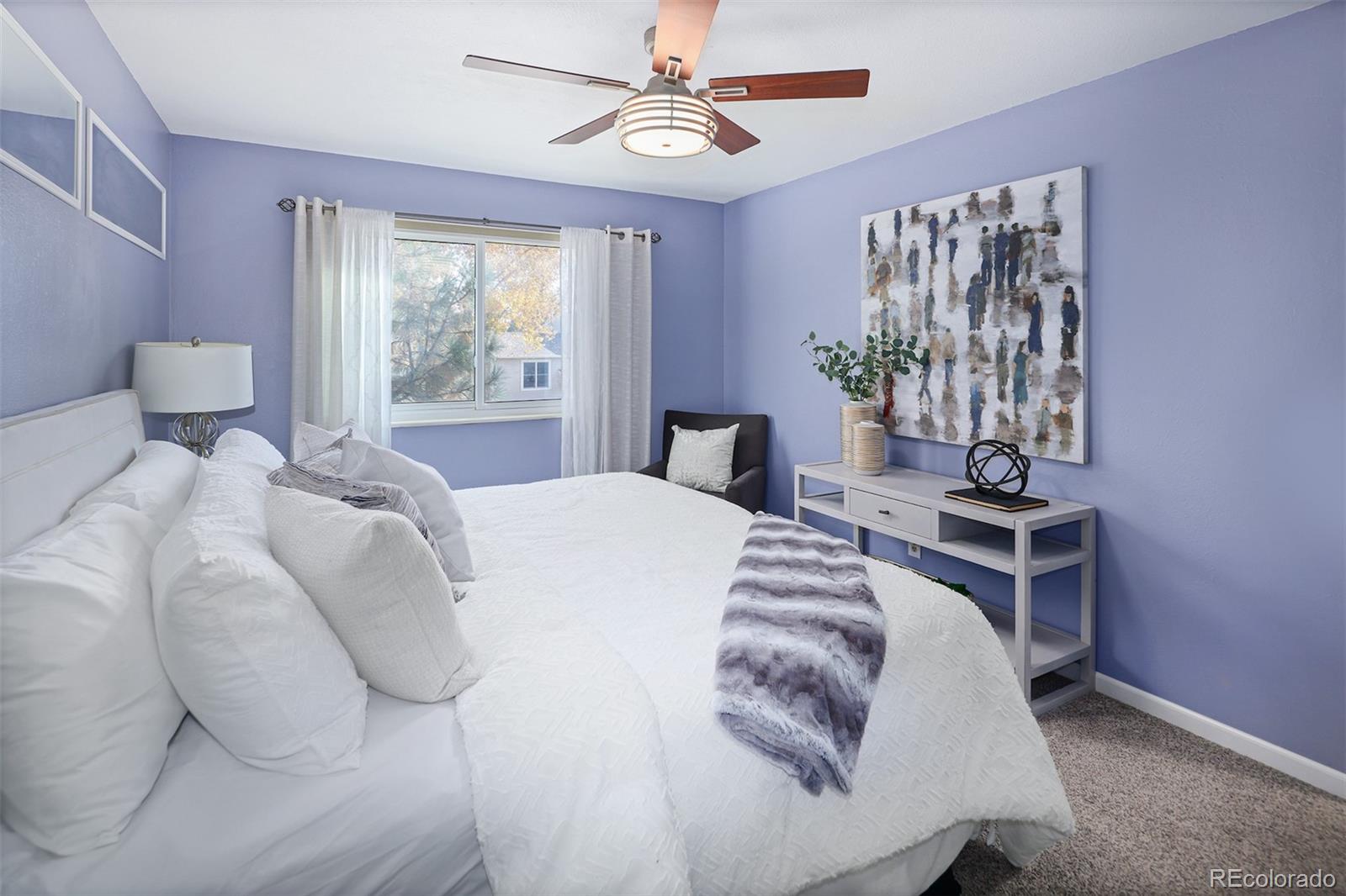 10499 Newcombe Street Westminster, CO 80021 - Photo 20 of 33 a bedroom with a large bed and a window