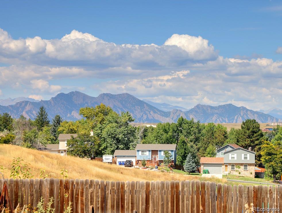 10499 Newcombe Street Westminster, CO 80021 - Photo 5 of 33 a balcony with street view