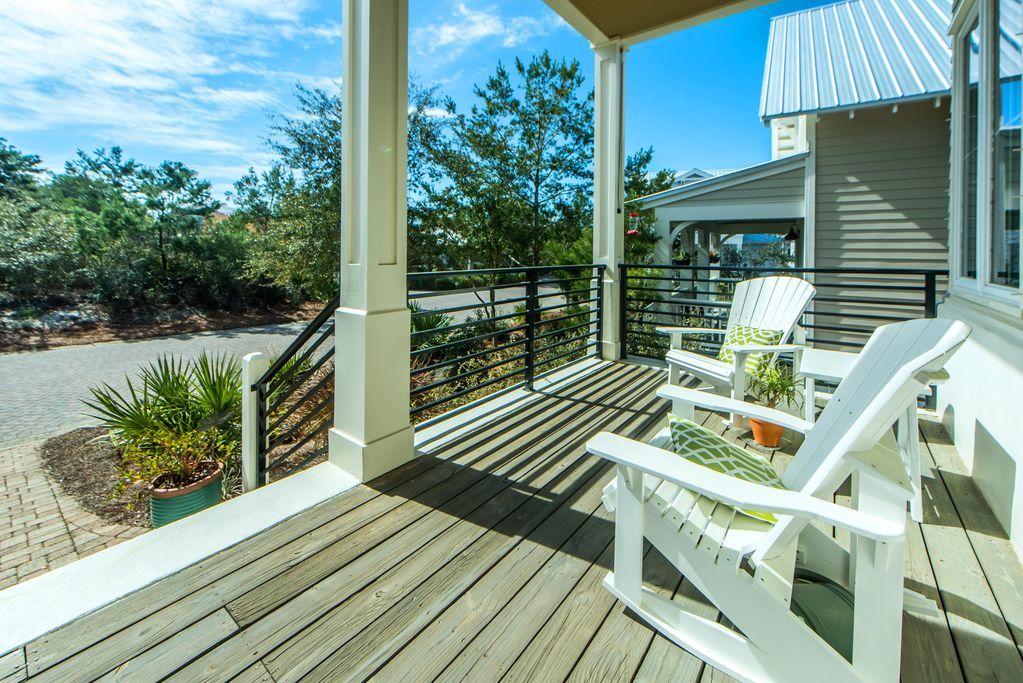 93 Gulfview Circle Santa Rosa Beach, FL 32459 - Photo 16 of 55 a balcony with wooden floor and outdoor seating