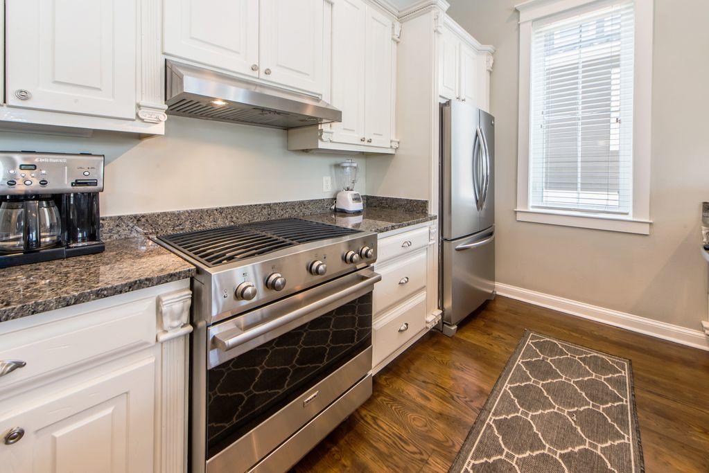 93 Gulfview Circle Santa Rosa Beach, FL 32459 - Photo 20 of 55 a kitchen with granite countertop a stove and a refrigerator