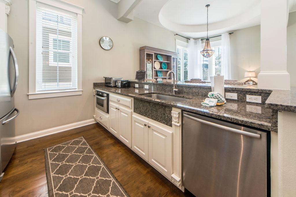 93 Gulfview Circle Santa Rosa Beach, FL 32459 - Photo 22 of 55 a kitchen with stainless steel appliances granite countertop a sink and cabinets