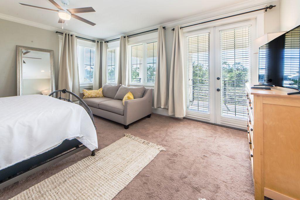 93 Gulfview Circle Santa Rosa Beach, FL 32459 - Photo 30 of 55 a spacious bedroom with a large bed and a couch