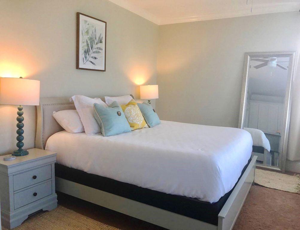93 Gulfview Circle Santa Rosa Beach, FL 32459 - Photo 40 of 55 a bedroom with a bed and a lamp on dresser