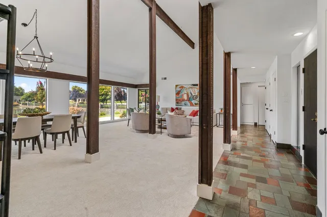 a view of a dining room with furniture window and outside view