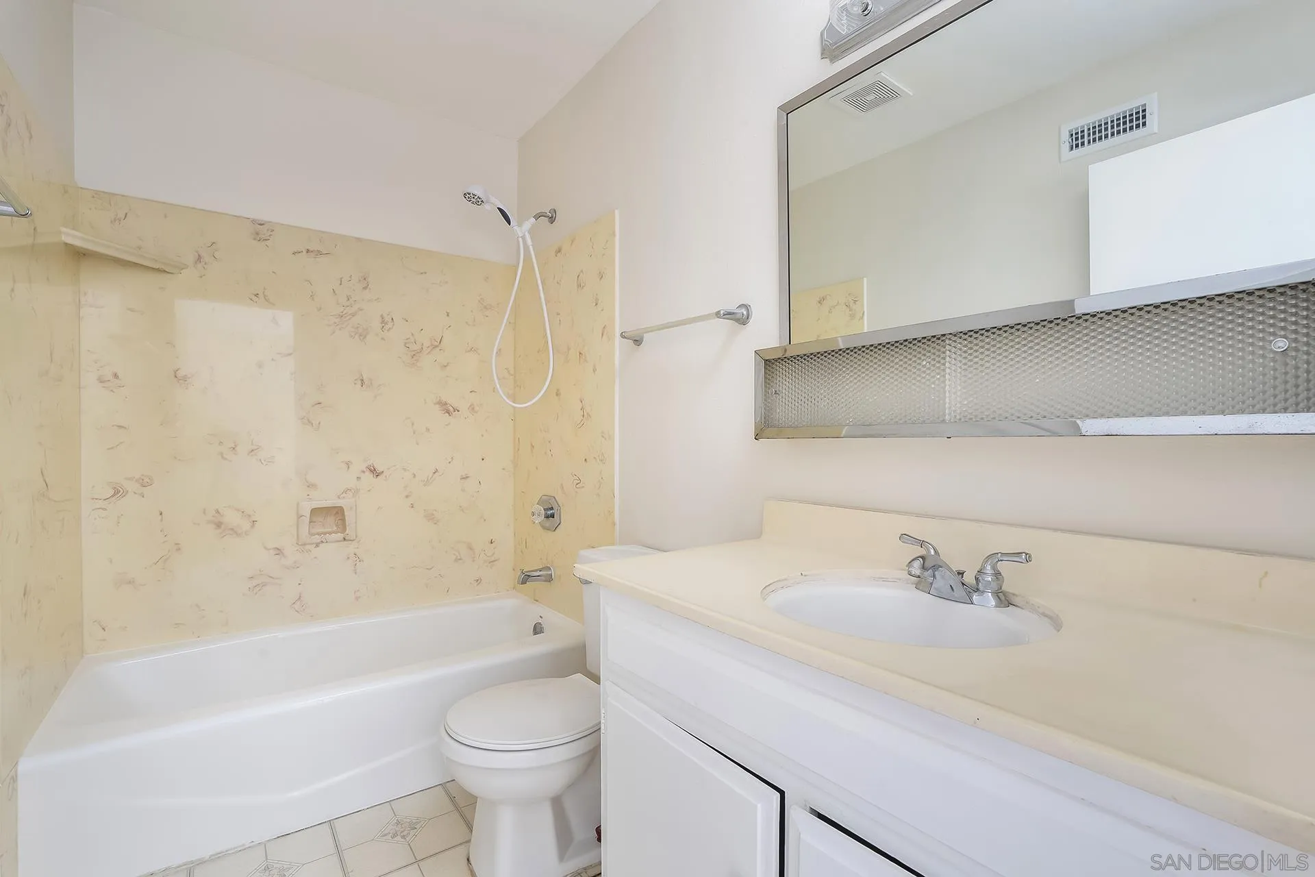 2014 Terraspiro Avenue Spring Valley, CA 91977 - Photo 18 of 28 a bathroom with a sink a toilet and a bathtub