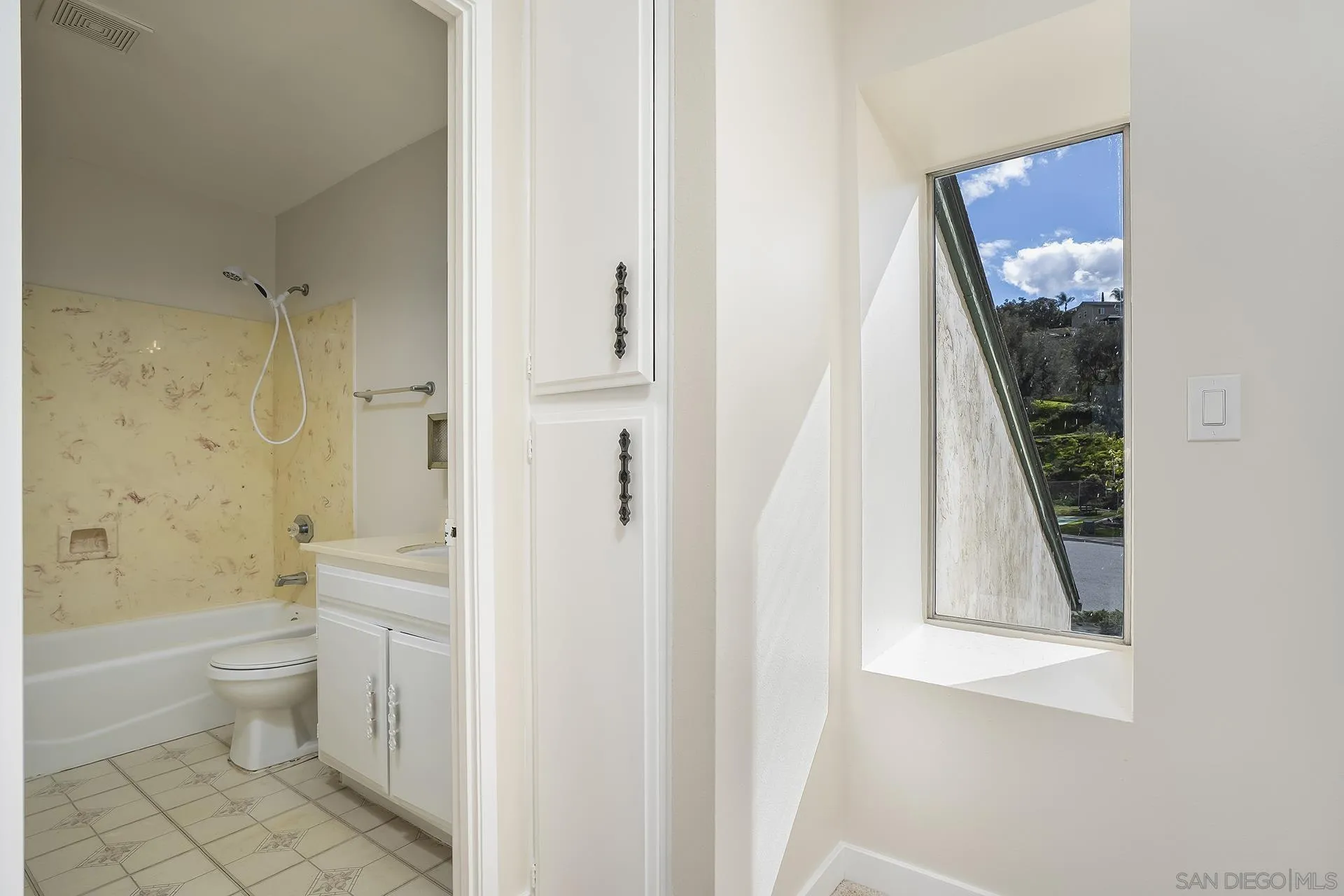 2014 Terraspiro Avenue Spring Valley, CA 91977 - Photo 19 of 28 a bathroom with a sink a toilet and shower