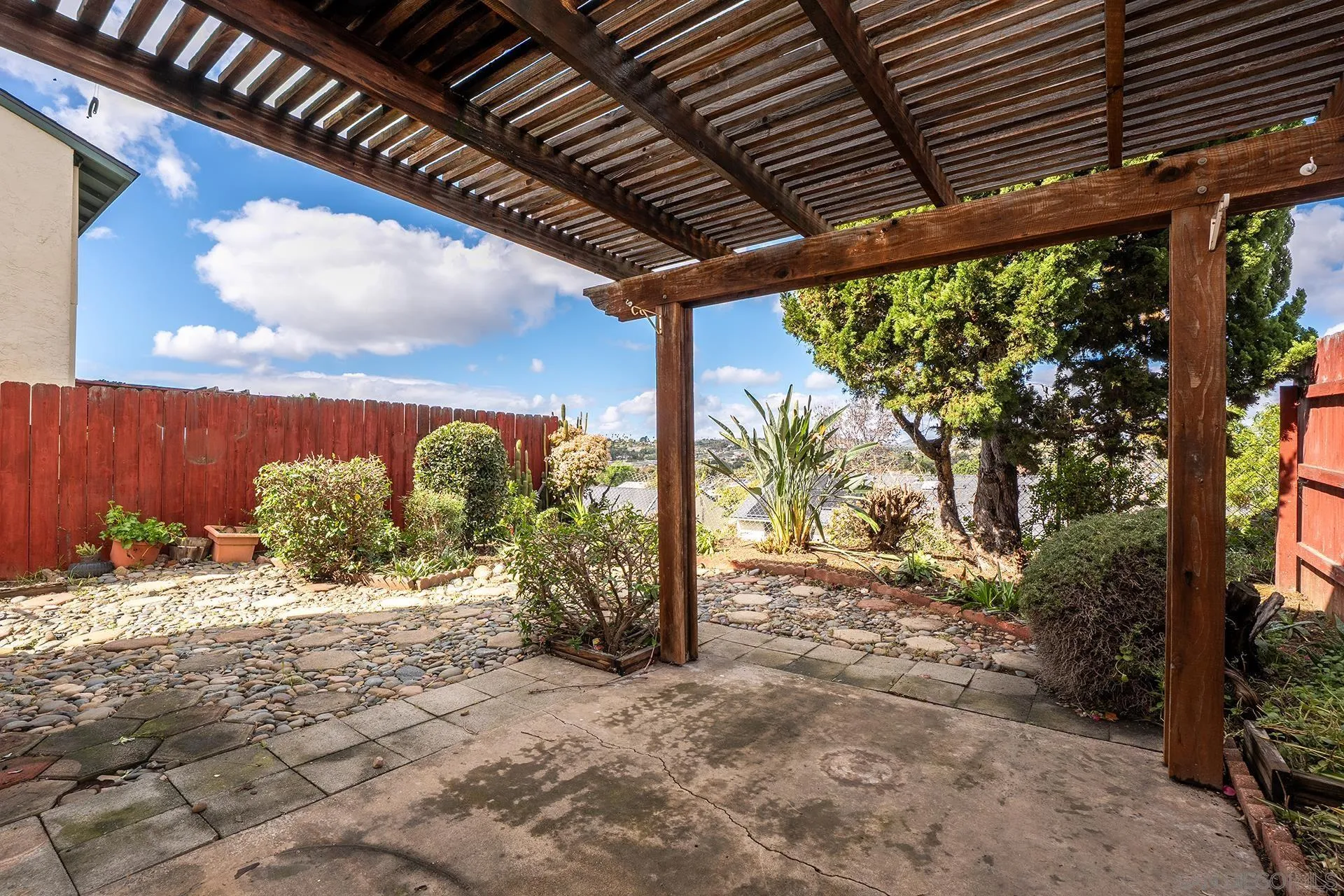 2014 Terraspiro Avenue Spring Valley, CA 91977 - Photo 22 of 28 a view of a backyard with large trees and plants