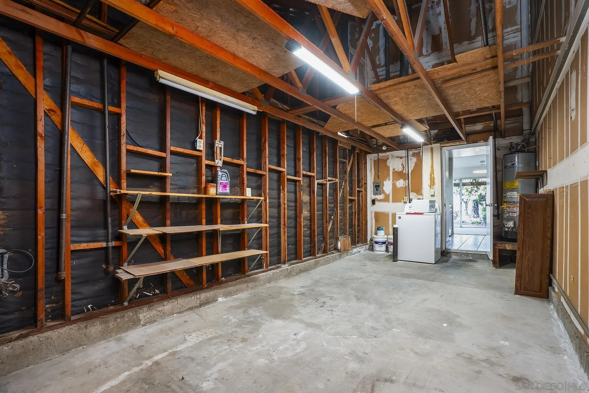 2014 Terraspiro Avenue Spring Valley, CA 91977 - Photo 25 of 28 a view of an empty room with wooden shelves