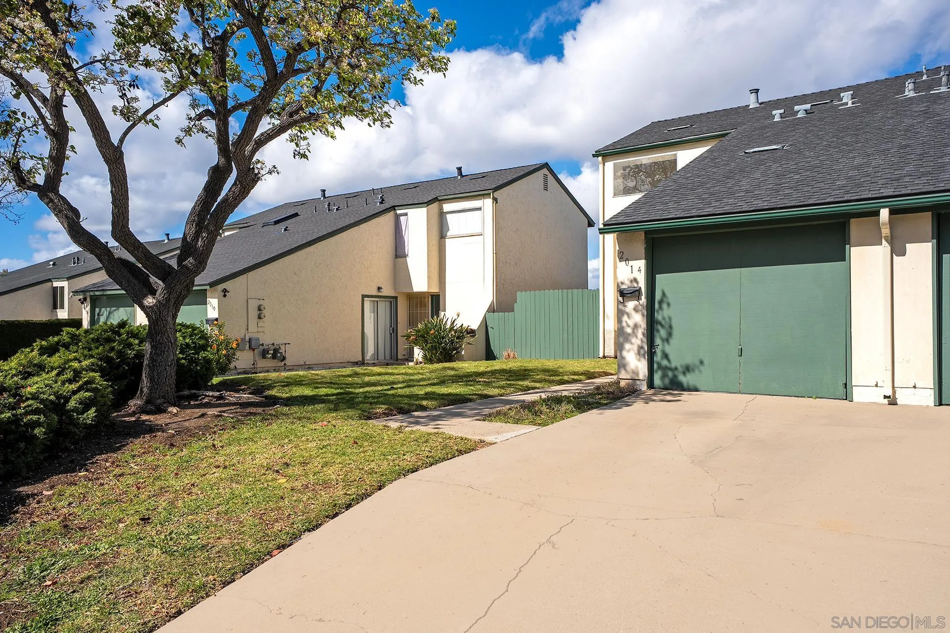 2014 Terraspiro Avenue Spring Valley, CA 91977 - Photo 3 of 28 a view of a house with a yard and garage