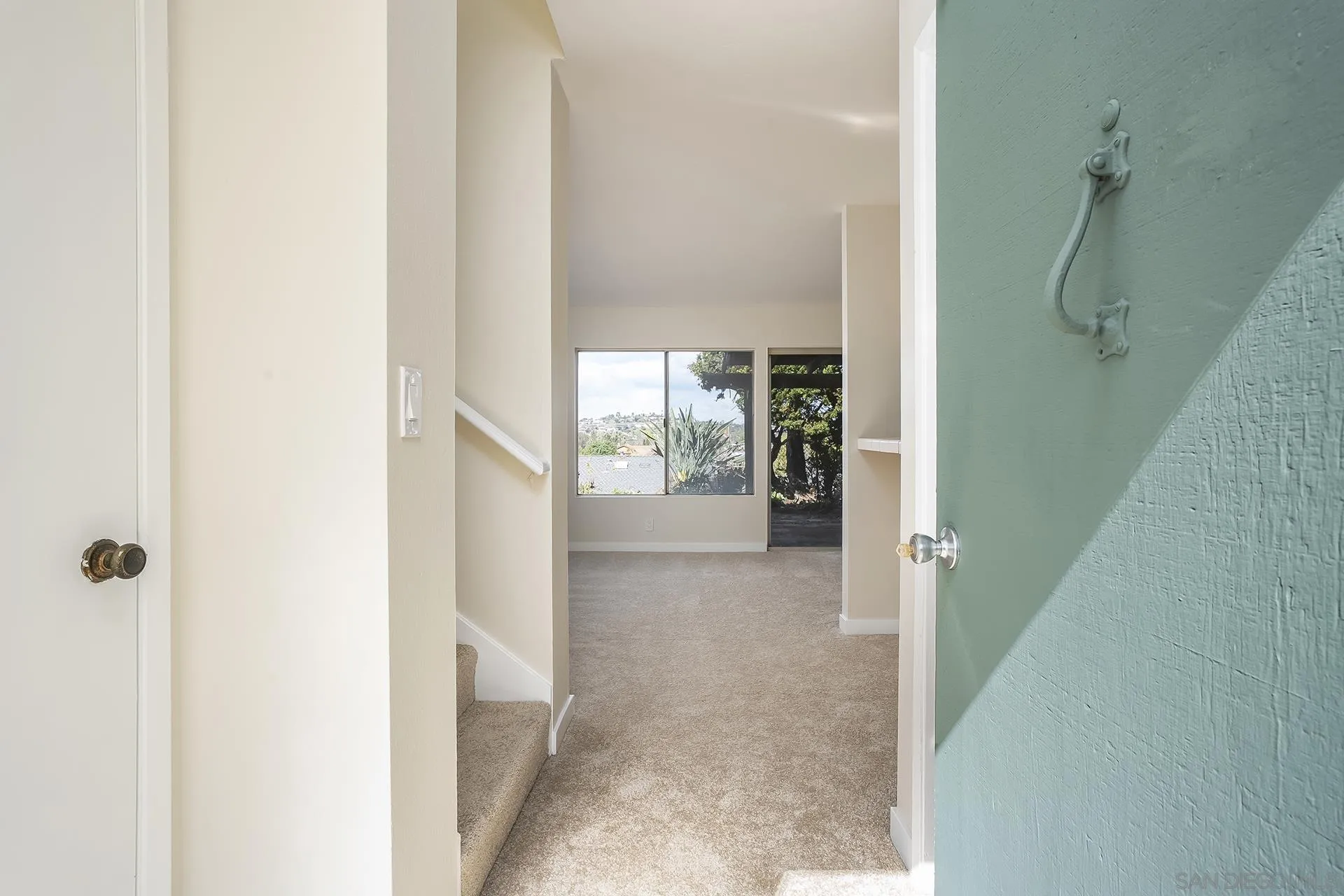 2014 Terraspiro Avenue Spring Valley, CA 91977 - Photo 4 of 28 a view of a hallway with a glass door and shower