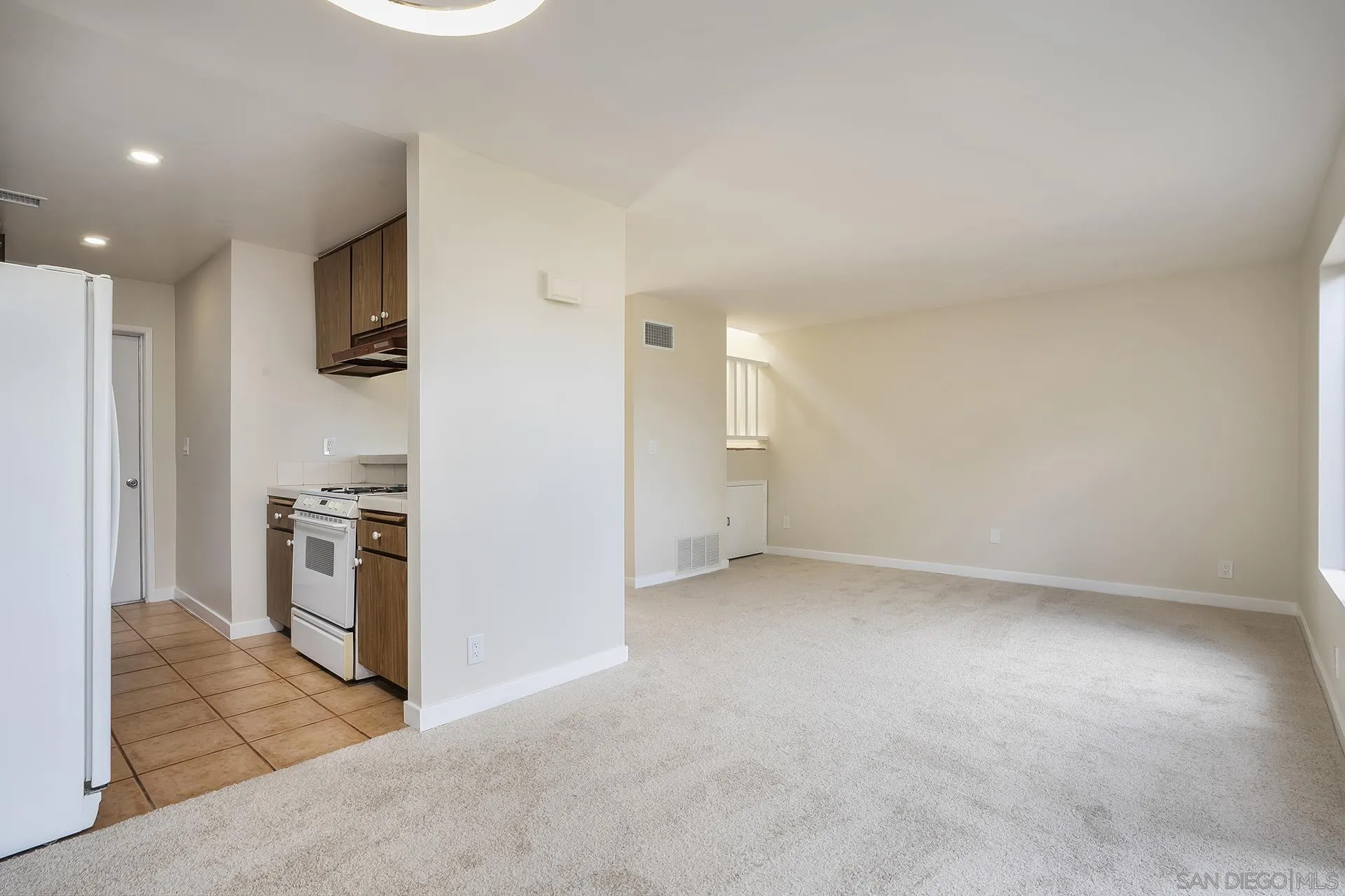 2014 Terraspiro Avenue Spring Valley, CA 91977 - Photo 10 of 28 a view of a kitchen with a sink stove and refrigerator