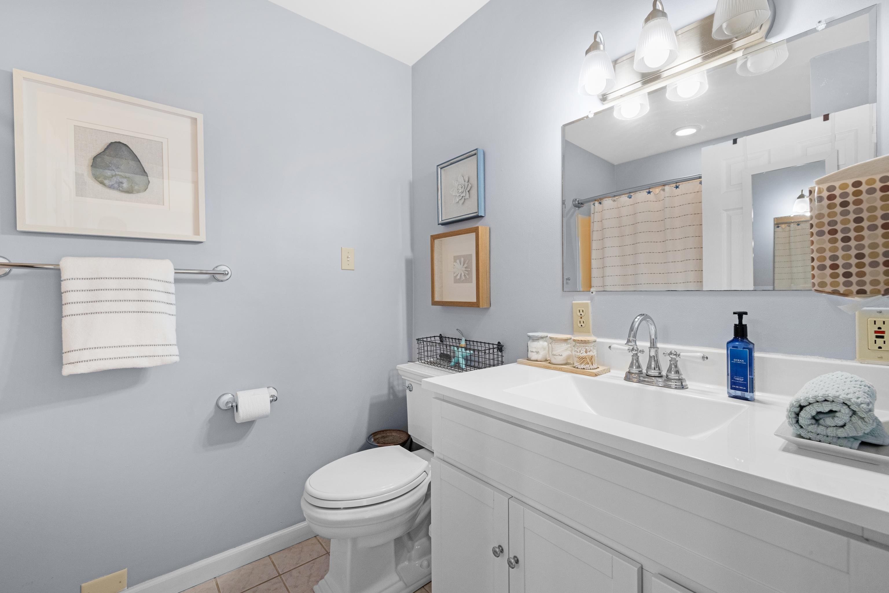 511 Forest Cape Villas, NJ 08251 - Photo 19 of 48 a bathroom with a toilet sink and mirror