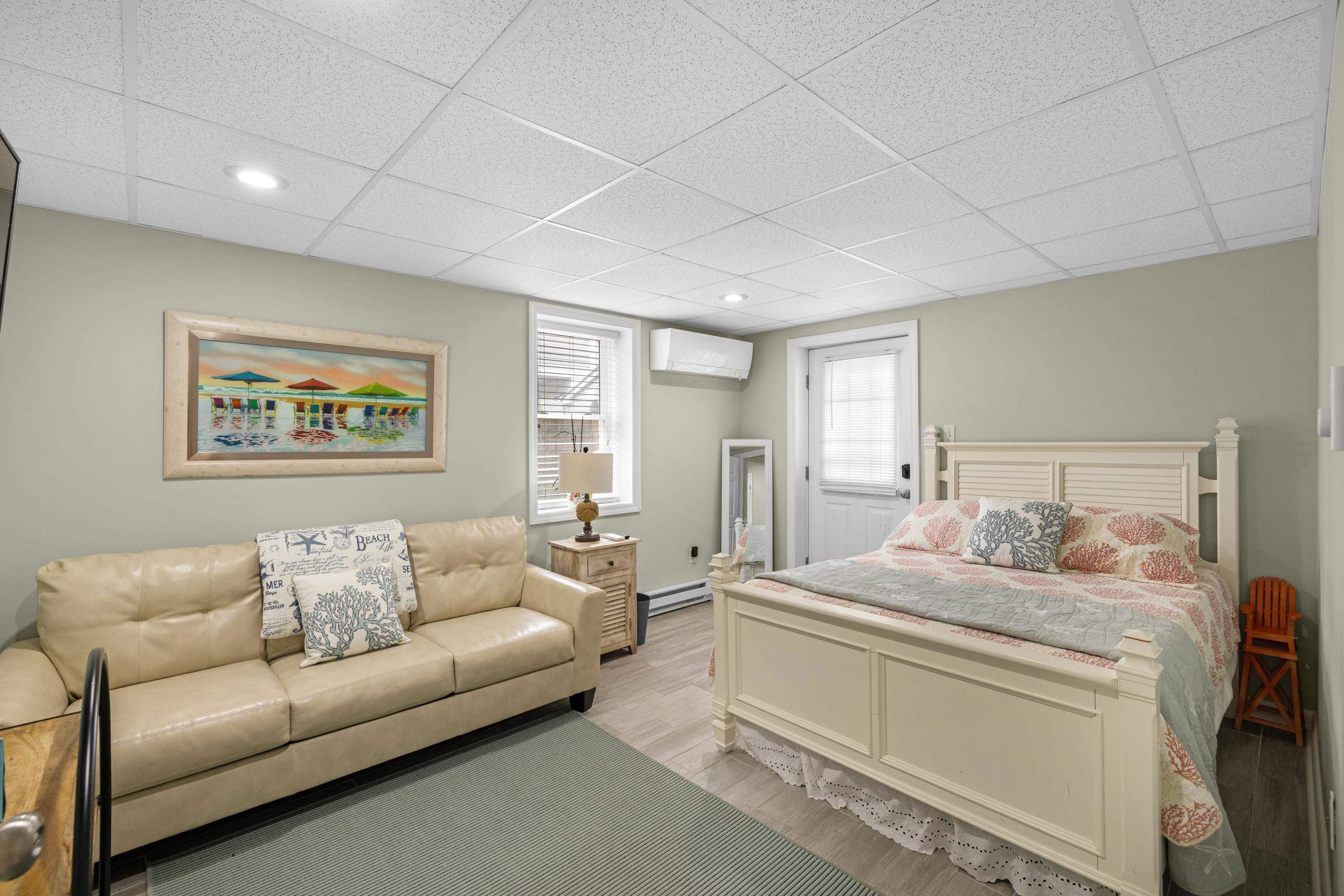 511 Forest Cape Villas, NJ 08251 - Photo 27 of 48 a bedroom with furniture and a couch