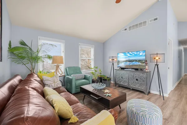 a living room with furniture and a window