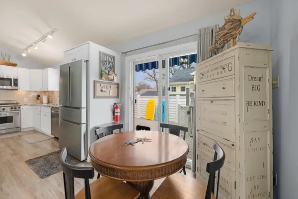 a kitchen with stainless steel appliances granite countertop a sink refrigerator and stove