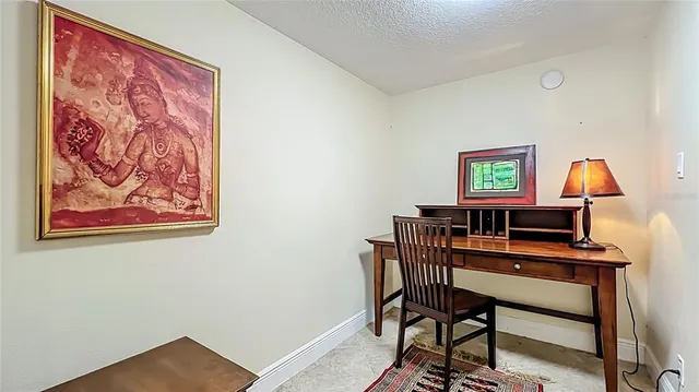 a view of a hallway with wooden floor and closet