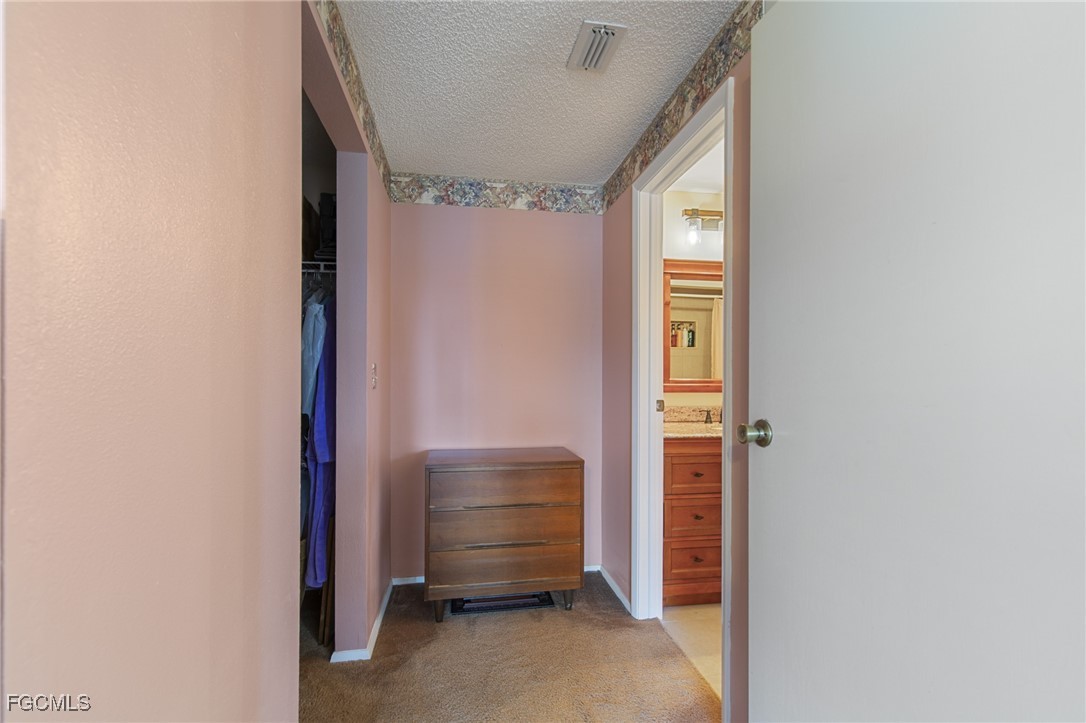 4496 31st Avenue Southwest Naples, FL 34116 - Photo 12 of 26 a room that has a bed and a window