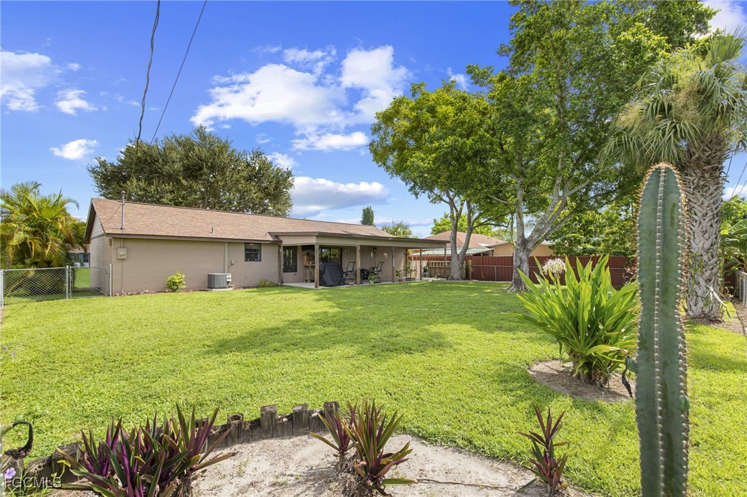 4496 31st Avenue Southwest Naples, FL 34116 - Photo 19 of 26 a view of a house with a garden