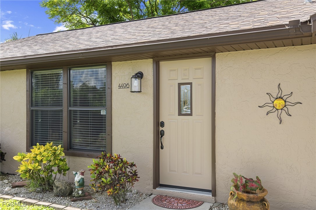 4496 31st Avenue Southwest Naples, FL 34116 - Photo 2 of 26 a front view of a house