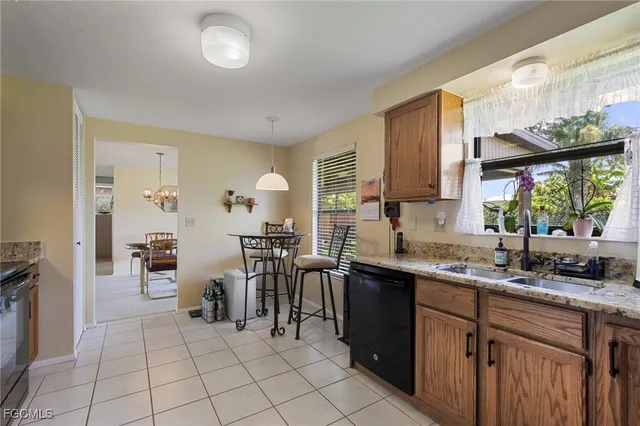 a kitchen with lots of counter top space and dining table