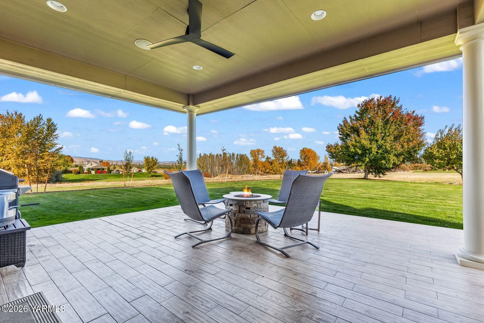 13507 West Church Road Yakima, WA 98903 - Photo 31 of 46 a roof deck with table and chairs and garden
