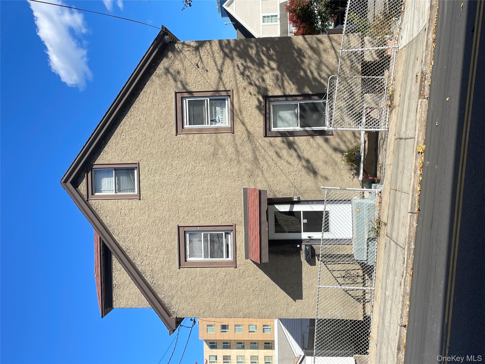 Traditional home with stucco siding