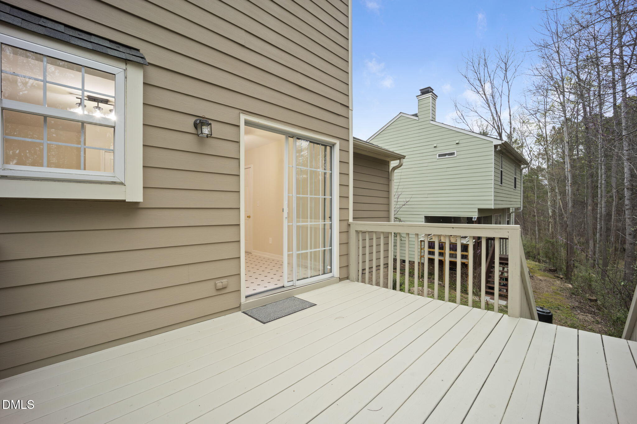 900 Spring Meadow Drive Durham, NC 27713 - Photo 12 of 26 a view of backyard with wooden deck and large trees