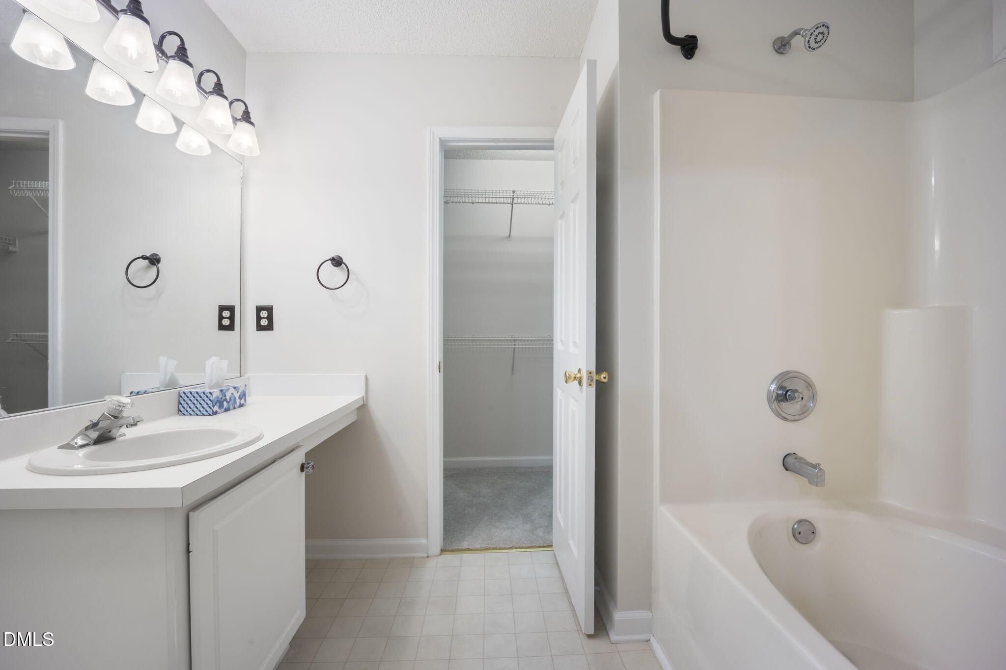 900 Spring Meadow Drive Durham, NC 27713 - Photo 16 of 26 a bathroom with a sink a toilet and shower