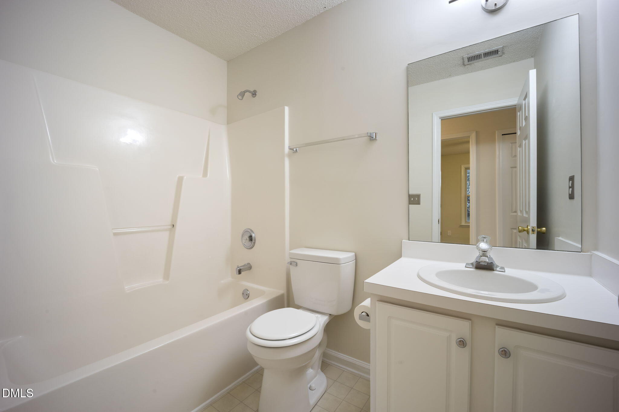 900 Spring Meadow Drive Durham, NC 27713 - Photo 23 of 26 a bathroom with a sink a toilet and shower