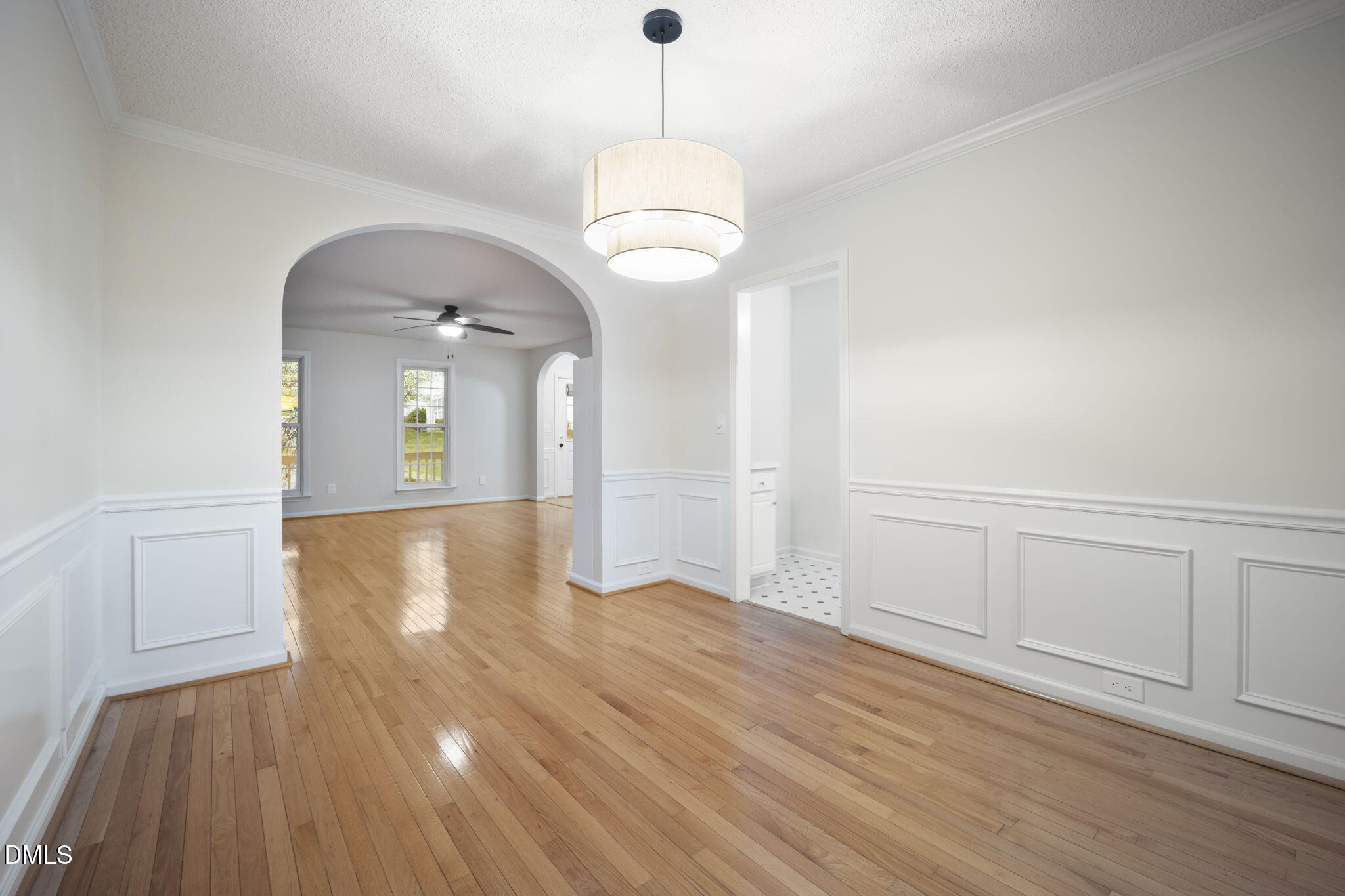 900 Spring Meadow Drive Durham, NC 27713 - Photo 7 of 26 wooden floor in an empty room with a window