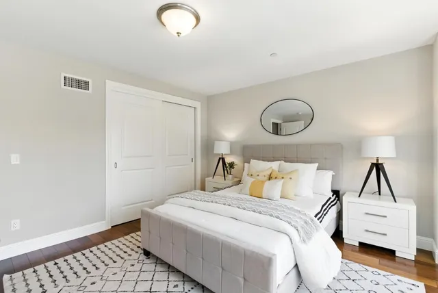 a bedroom with a bed and window