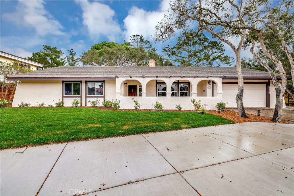 front view of a house with a small yard