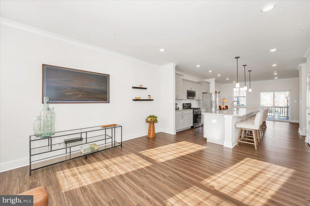 809 Teacher MItchell Road Glen Burnie, MD 21060 - Photo 10 of 54 Sunlit living room w/clear view into the kitchen