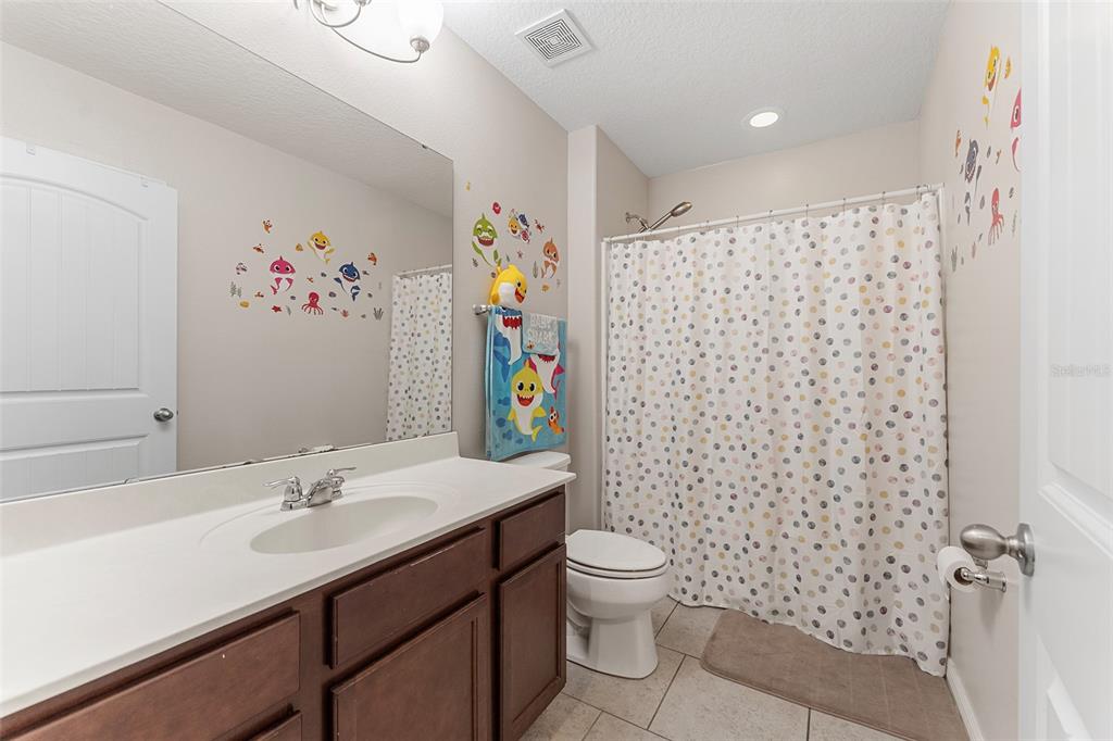 3523 Clay Brick Road St. Cloud, FL 34773 - Photo 22 of 62 a bathroom with a sink toilet and shower