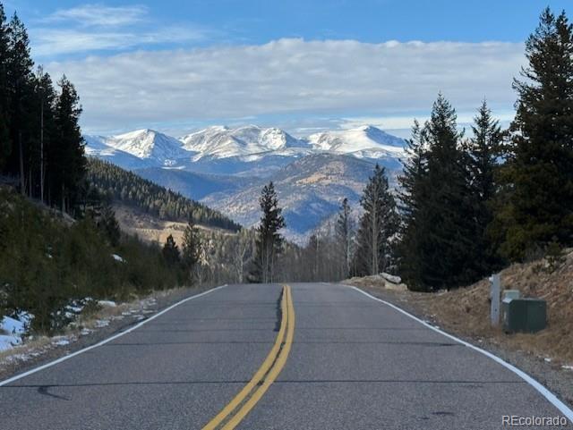 1695 Packsaddle Trail Evergreen, CO 80439 - Photo 6 of 7 a view of a house with a yard