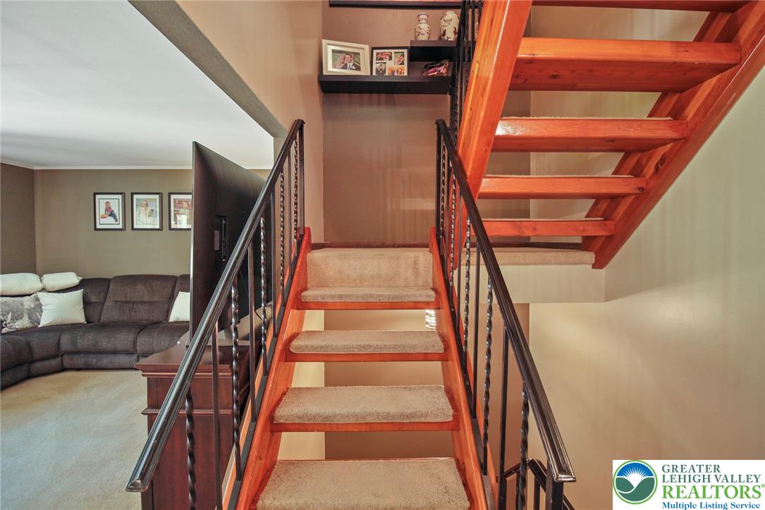3470 Brodhead Road Bethlehem, PA 18020 - Photo 52 of 84 Hardwood stairs with carpeted treads connect the levels of this comfortable living space.