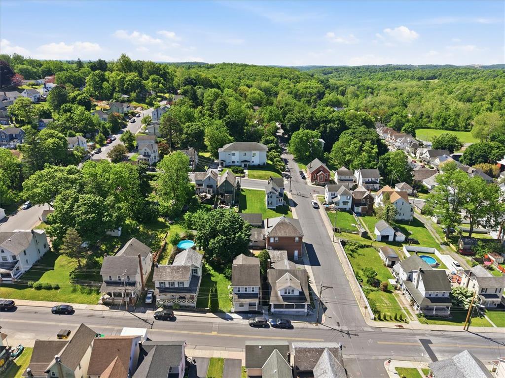 110 Messinger Street Bangor, PA 18013 - Photo 34 of 39 An aerial perspective reveals a vibrant neighborhood nestled among rolling, verdant hills.