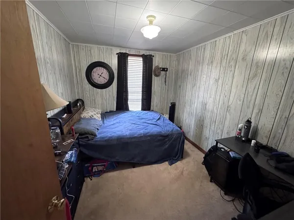 a bed room with a bed and a lamp