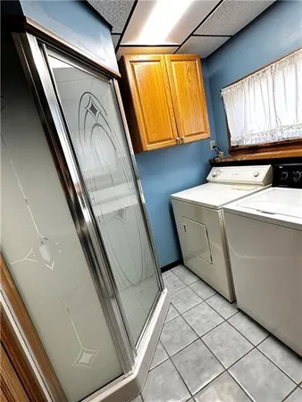 a utility room with closet and window