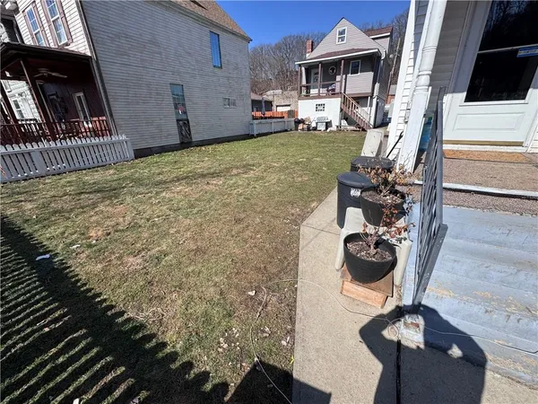 a view of living room kitchen and entryway
