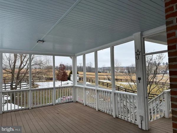 a view of a balcony with wooden floor