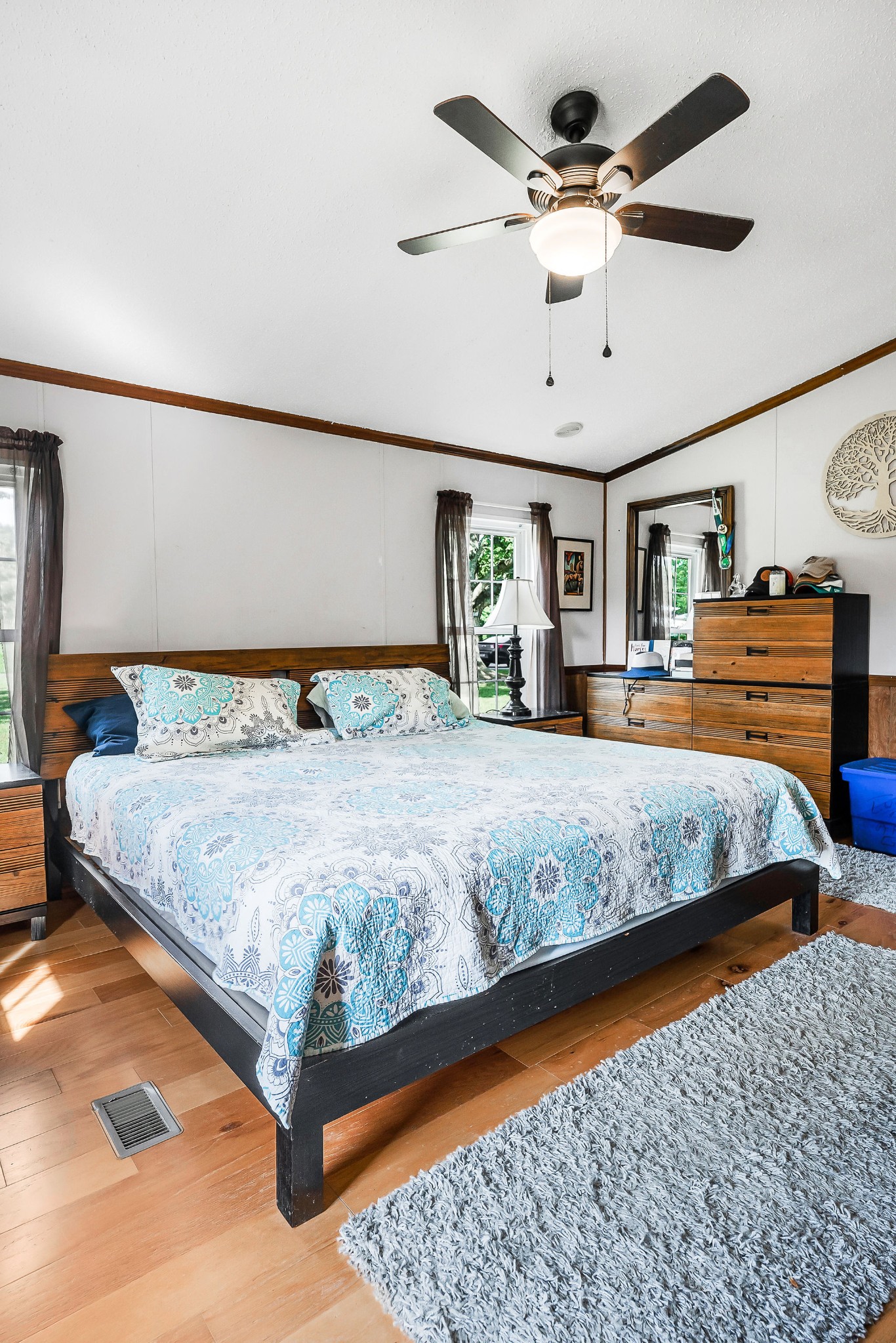227 B A R Road Baxter, TN 38544 - Photo 14 of 52 a bedroom with a bed a ceiling fan and a dresser