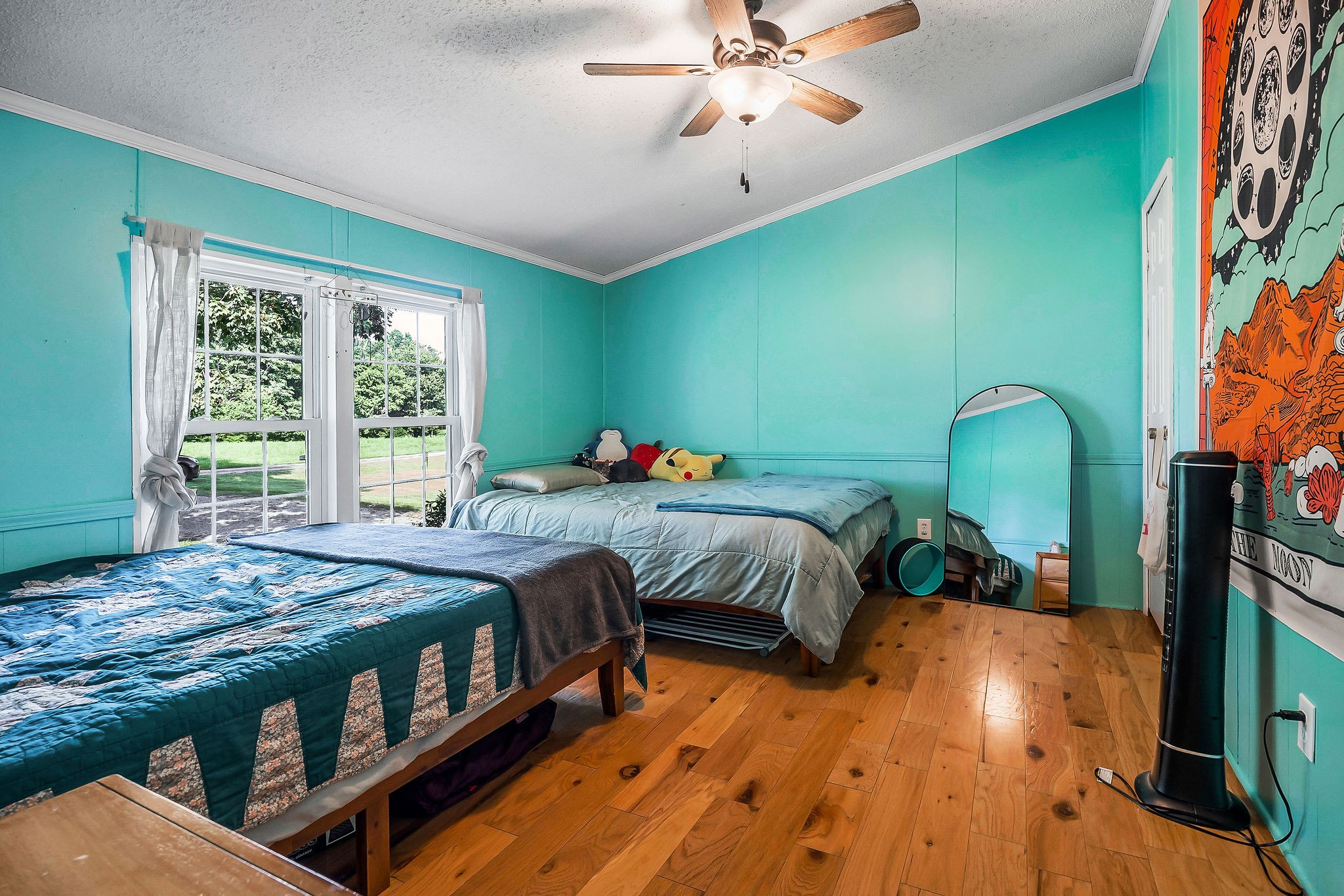 227 B A R Road Baxter, TN 38544 - Photo 21 of 52 a bedroom with a bed and a chandelier