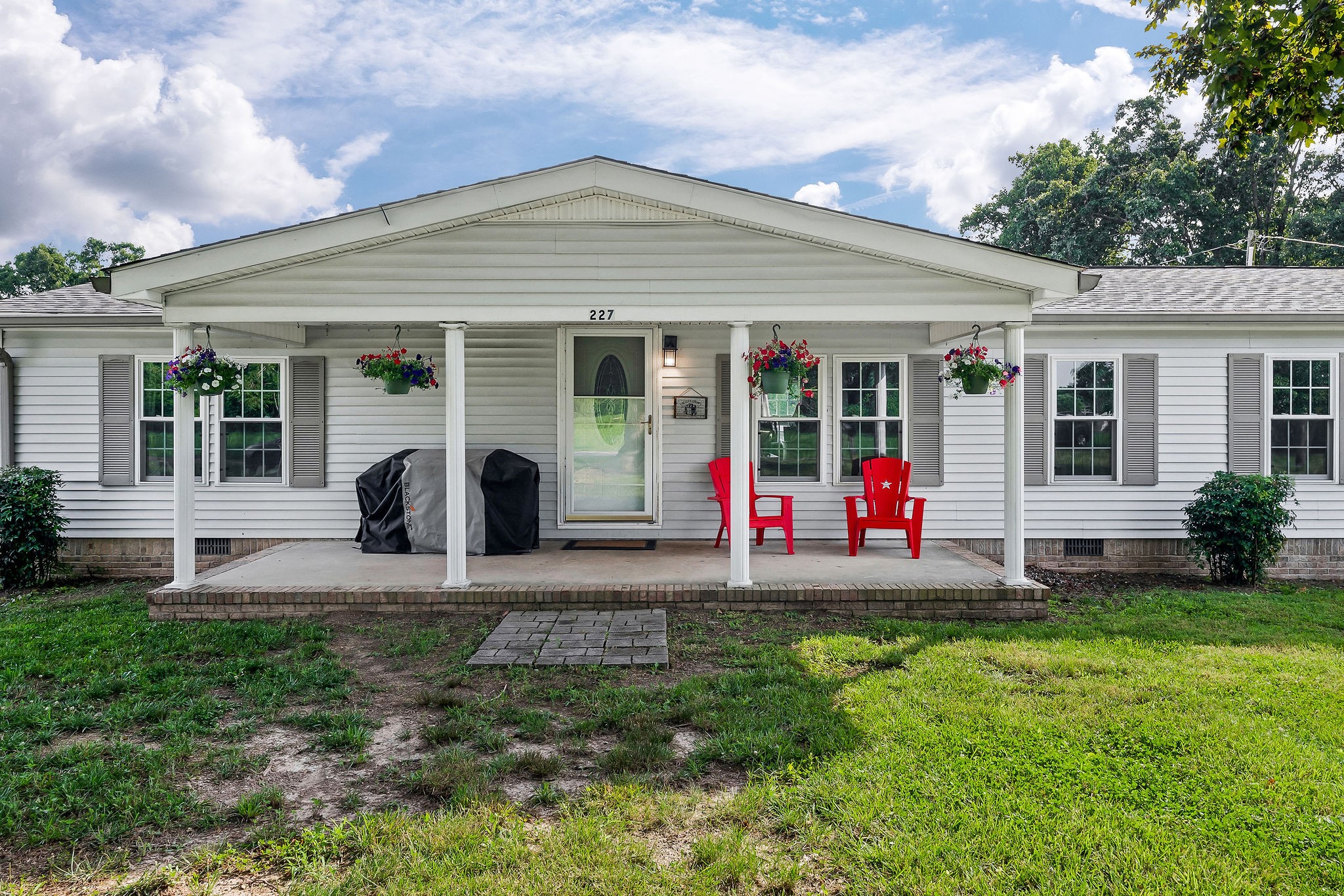 227 B A R Road Baxter, TN 38544 - Photo 39 of 52 a front view of a house with a yard and garage